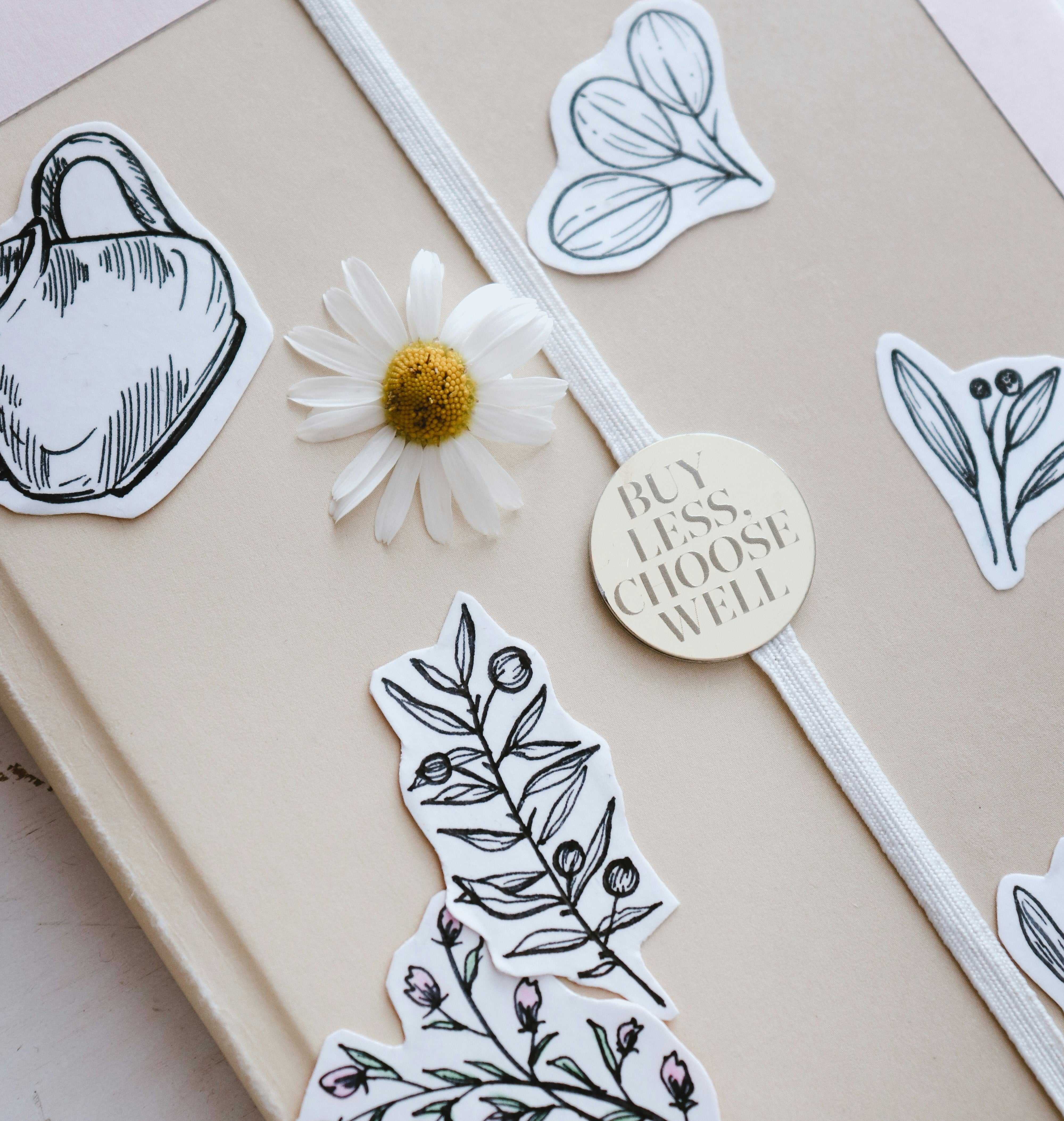 Journal with stickers and a flower